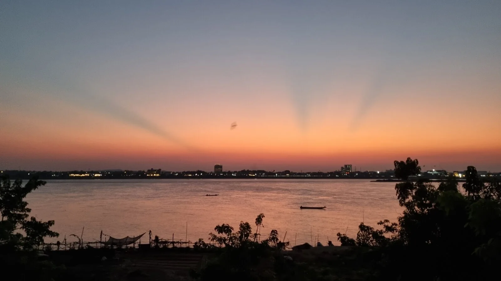 sunset and burning skies over the mekong river in savannakhet