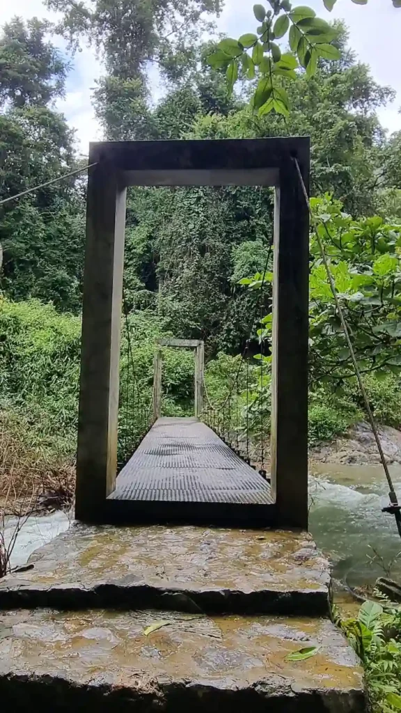 Bridge crossing the river on the trail to Kaeng Nyui Waterfall