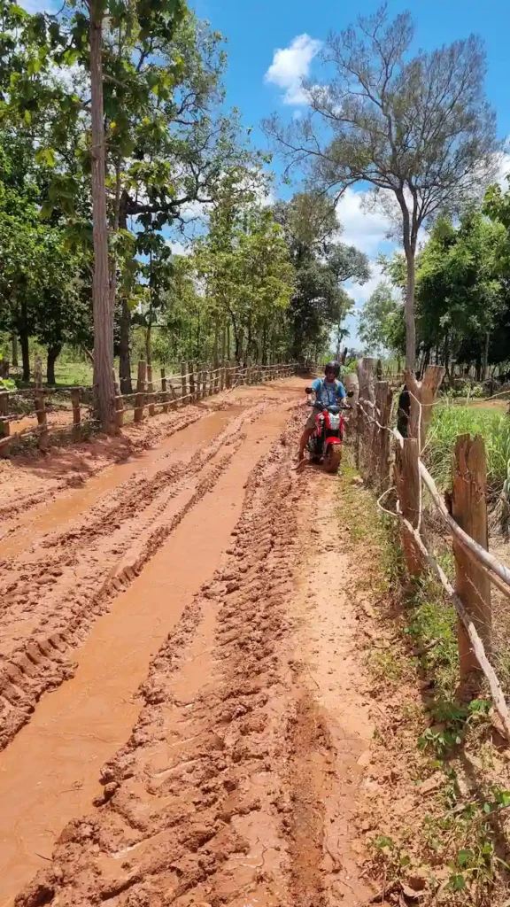 motorbike in laos muddy road conditions