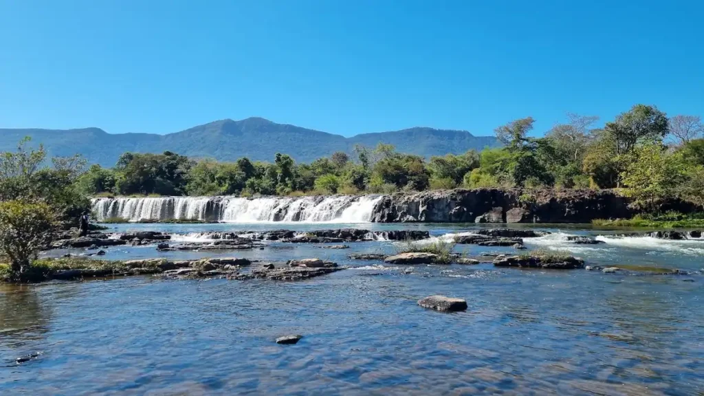 tad hua khon waterfall sekong mountain view in the background