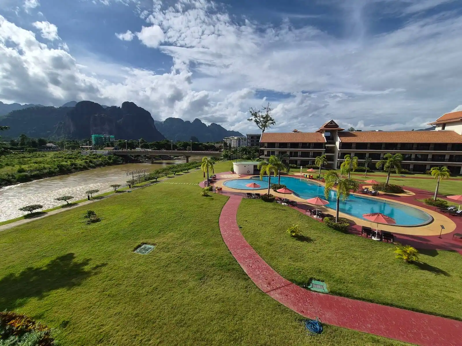 tmark resort vang vieng nam song river and mountains background